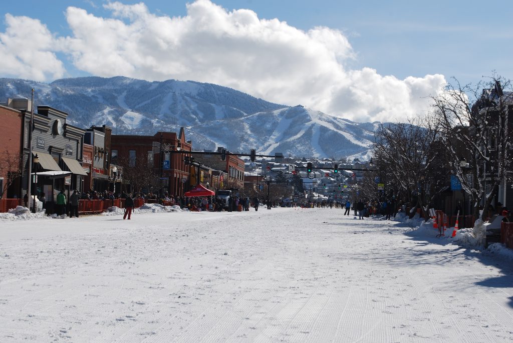 View of the Ski Mountain from town. The main street is covered in snow for winter carnival