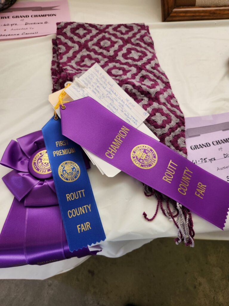 Woven Purple Scarf with Routt County Fair Award Ribbons
